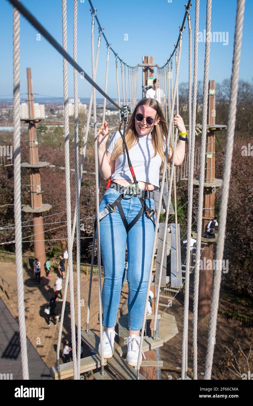 Climbers enjoy the warm weather at Go Ape at Alexandra Palace, in north London. Picture date: Thursday March 18, 2021. Temperatures in parts of the UK are expected to be significantly warmer this week as families and friends are reunited and sporting activities are allowed to resume in England following the relaxation of coronavirus restrictions. Stock Photo