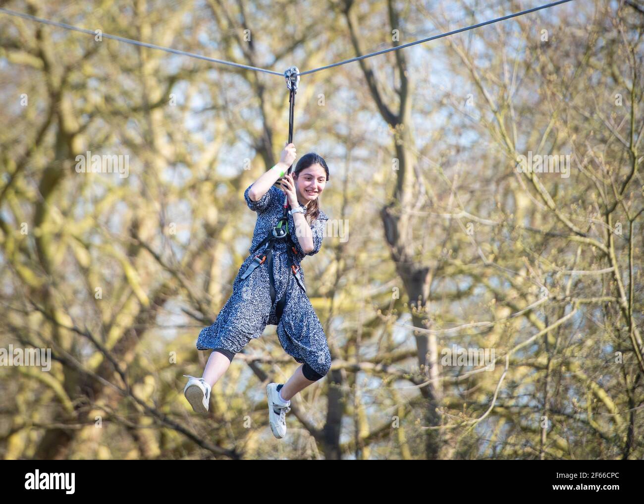 Climbers enjoy the warm weather at Go Ape at Alexandra Palace, in north London. Picture date: Thursday March 18, 2021. Temperatures in parts of the UK are expected to be significantly warmer this week as families and friends are reunited and sporting activities are allowed to resume in England following the relaxation of coronavirus restrictions. Stock Photo
