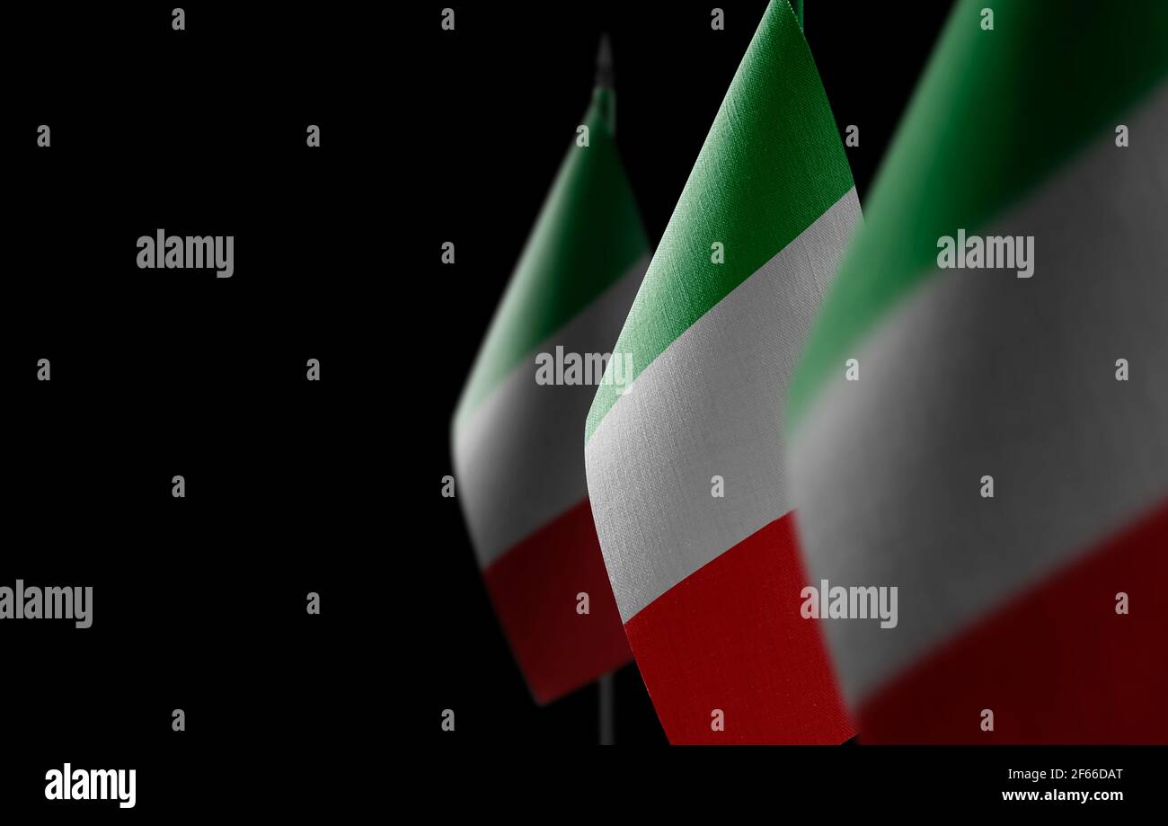Small national flags of the Italy on a black background Stock Photo