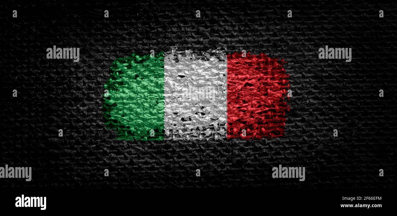 National flag of the Italy on dark fabric Stock Photo