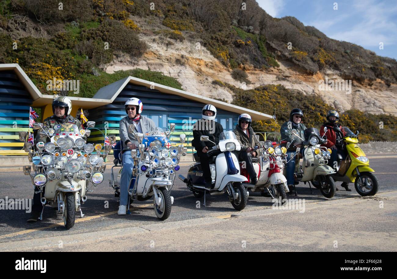 Members of a local scooter club on the sea front on Boscombe beach during a  socially distanced meet up. Picture date: Tuesday March 30, 2021.  Temperatures in parts of the UK are