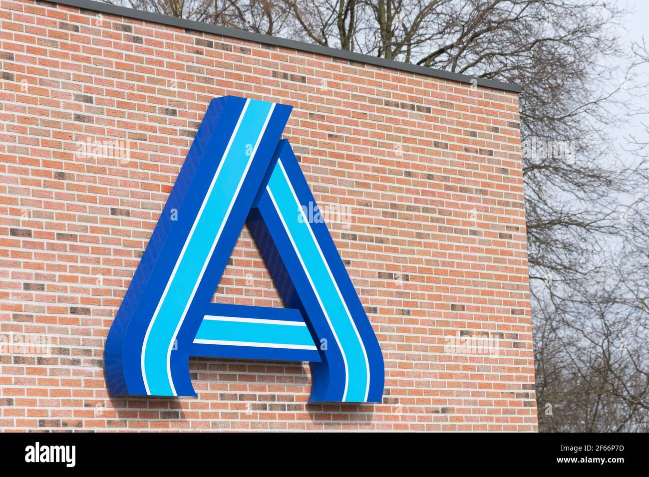 Sint Gillis Waas, Belgium, March 28, 2021, Logo of the supermarket chain Aldi on a stone wall Stock Photo