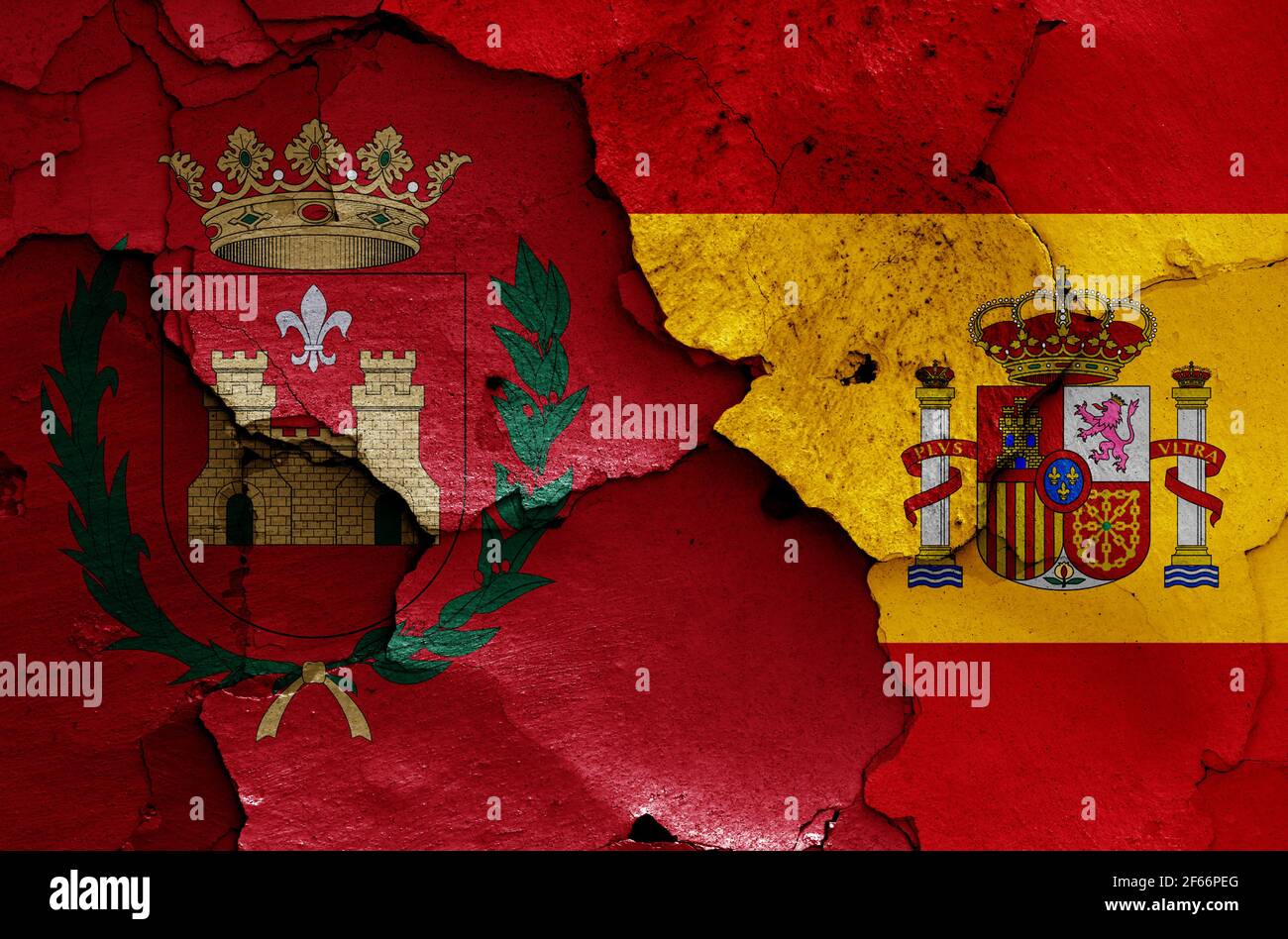 flags of Elda and Spain painted on cracked wall Stock Photo