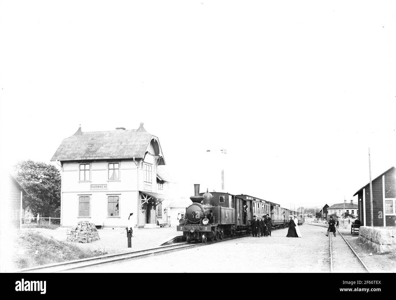 Saj 2 with passenger train, (Skövde - Axvall railroad) Traffic place landscaped in 1902-03. The building was expanded with an extension in 1914-15 and renovated in 1944. Two-storey wooden building with two end towards the track Stock Photo