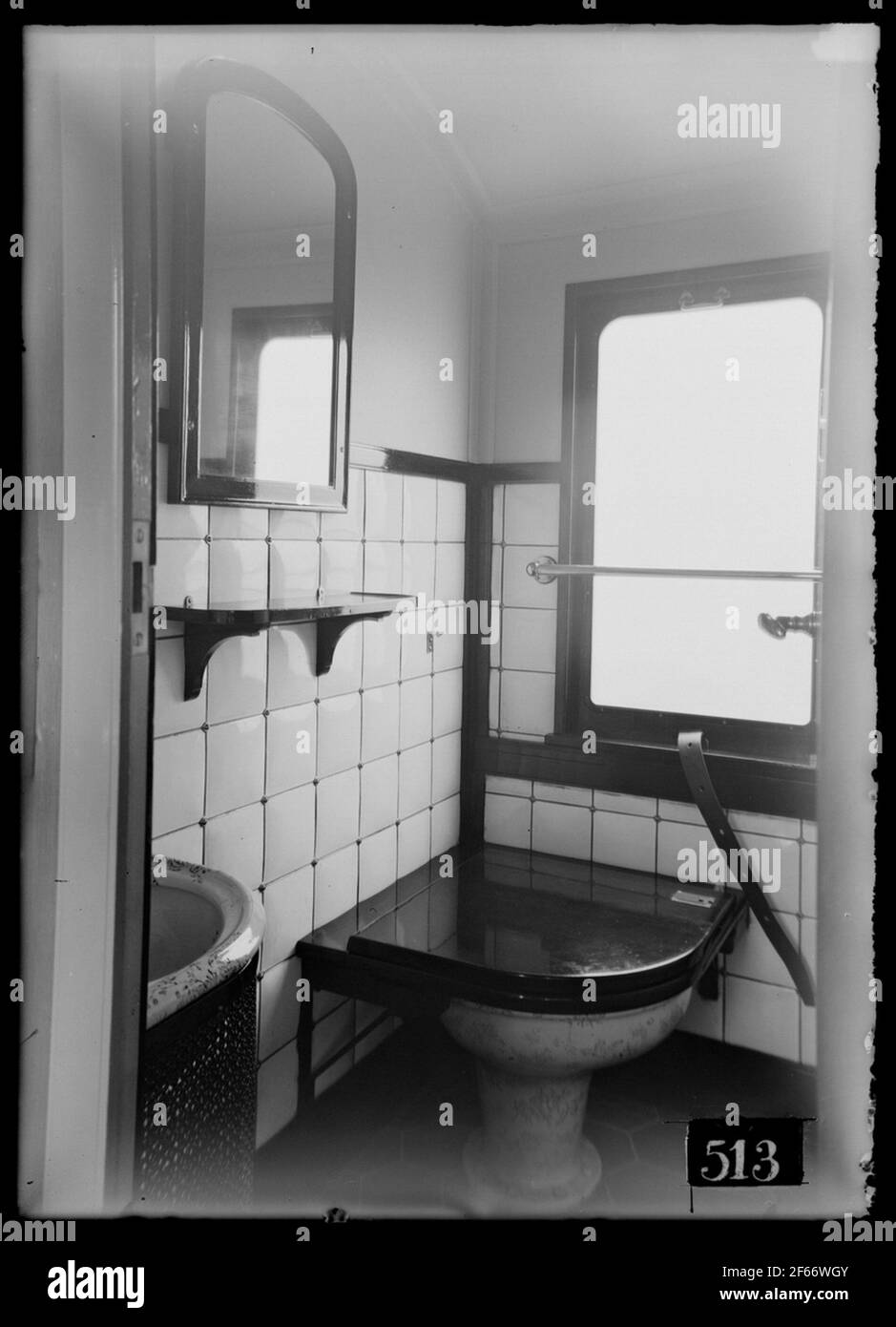 Interior from the toilet in the mail trolley. Norway's state banner ...