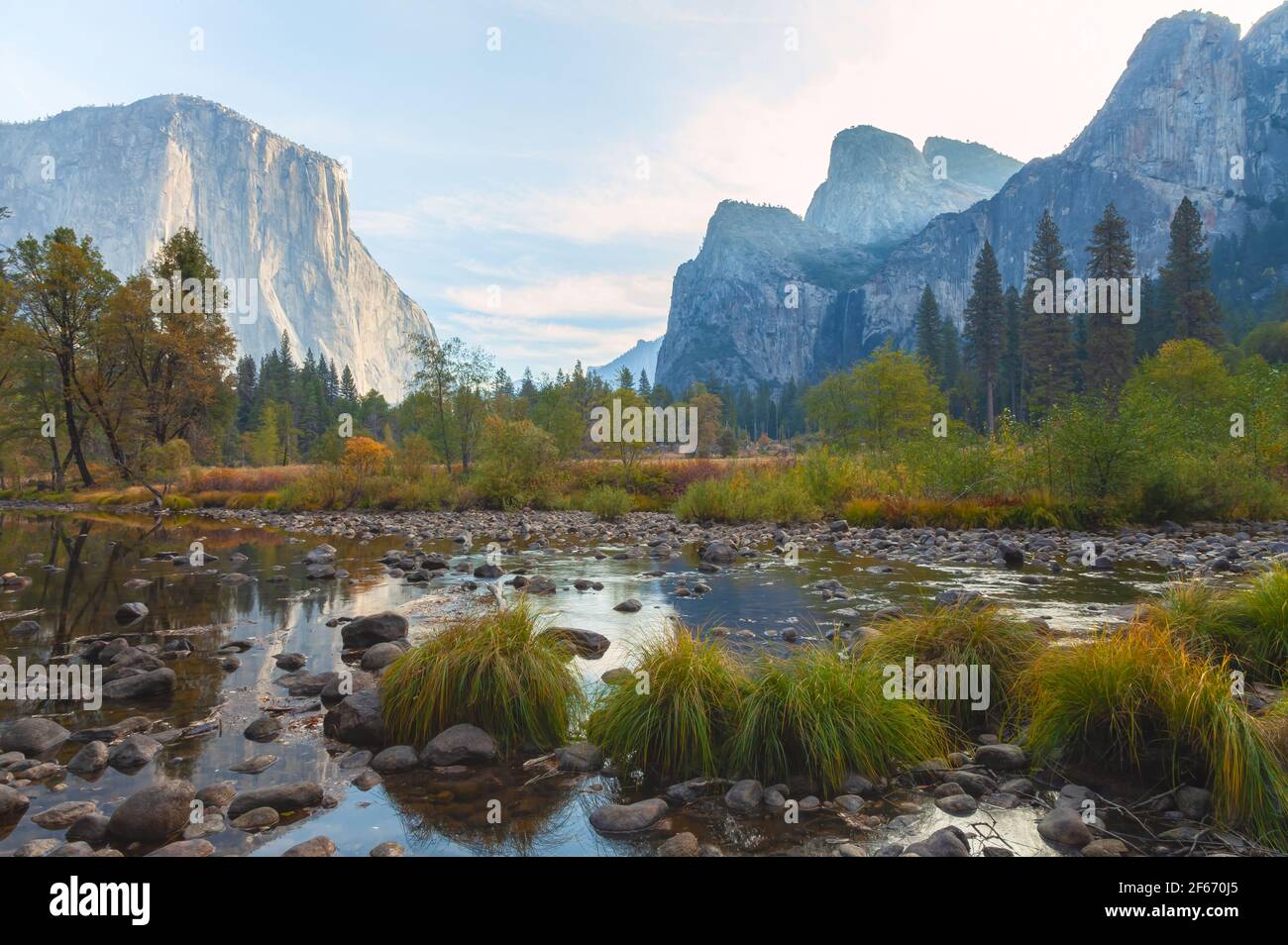 Iconic view of Yosemite Valley by the Merced River in late autumn, Yosemite National Park, California, USA, at sunrise. Stock Photo