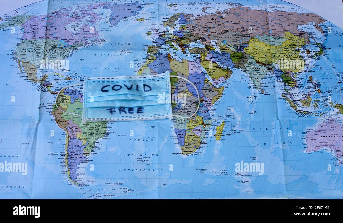planisphere with surgical mask with the words 'covid free' placed in the center between the continents Stock Photo
