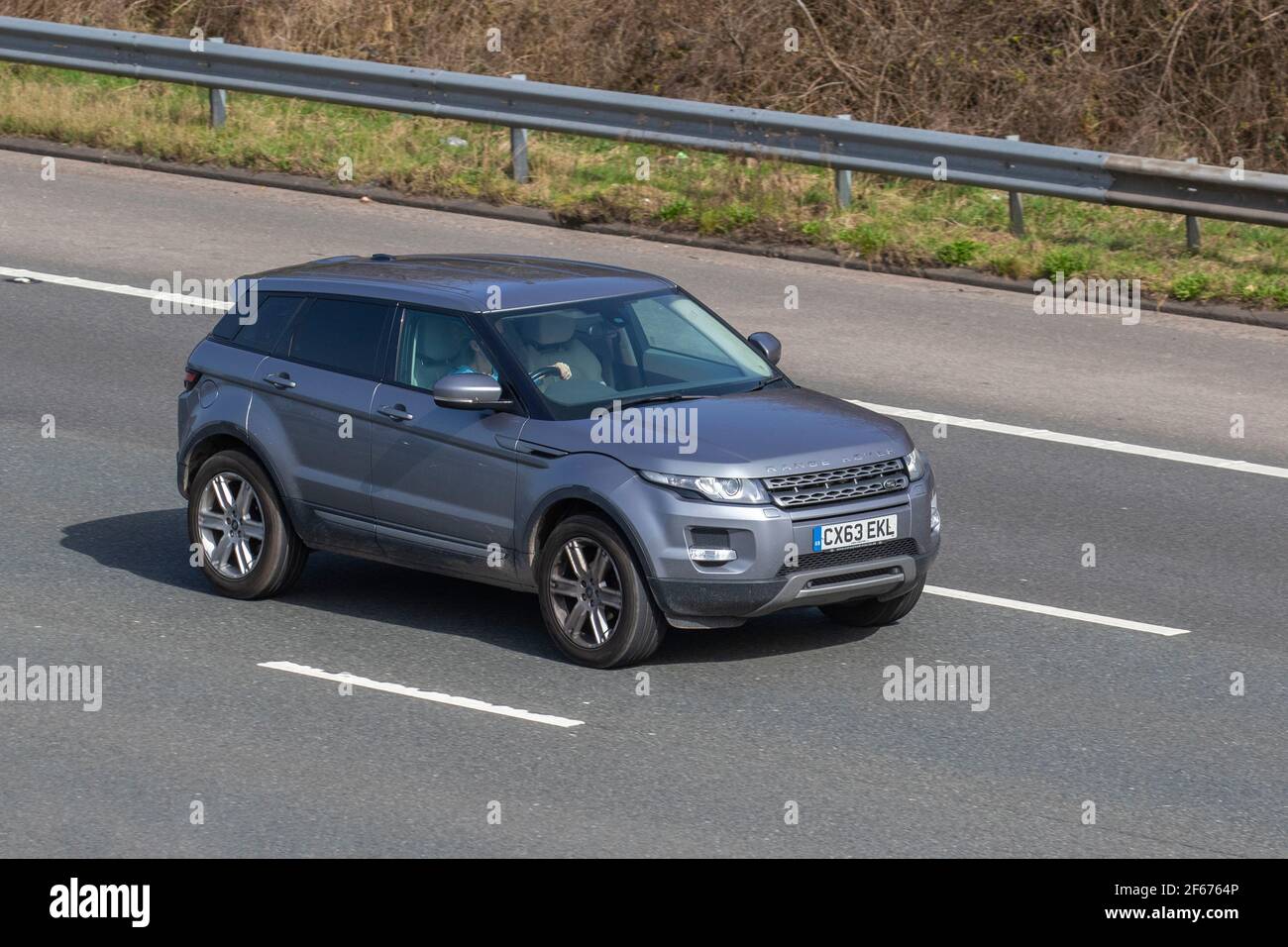2013 63 plate Land Range Rover Evoque Pure T Sd4 2179cc diesel SUV; Vehicular traffic, moving vehicles, cars, vehicle driving on UK roads, motors, motoring on the M6 highway English motorway road network Stock Photo