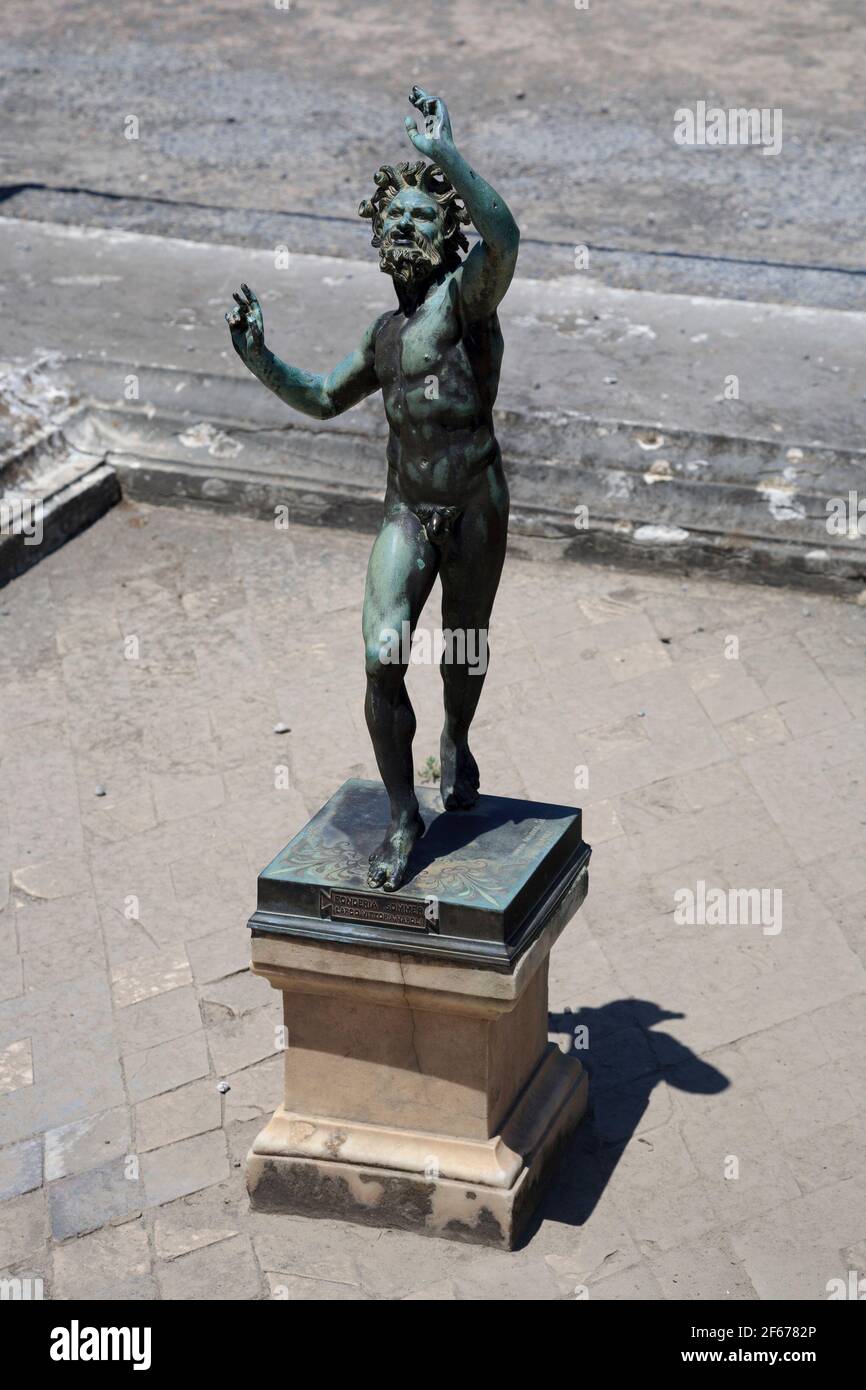 A copy of the 'Dancing Faun' statue in the House of the Faun atrium in Pompeii, Italy Stock Photo