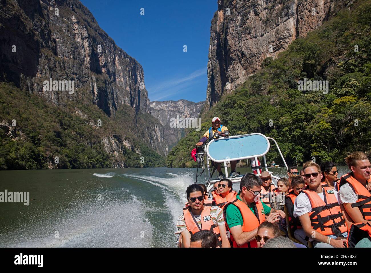 Motorboat / speedboat with tourists on the Grijalva River in the Sumidero Canyon National Park near Chiapa de Corzo, Chiapas, southern Mexico Stock Photo