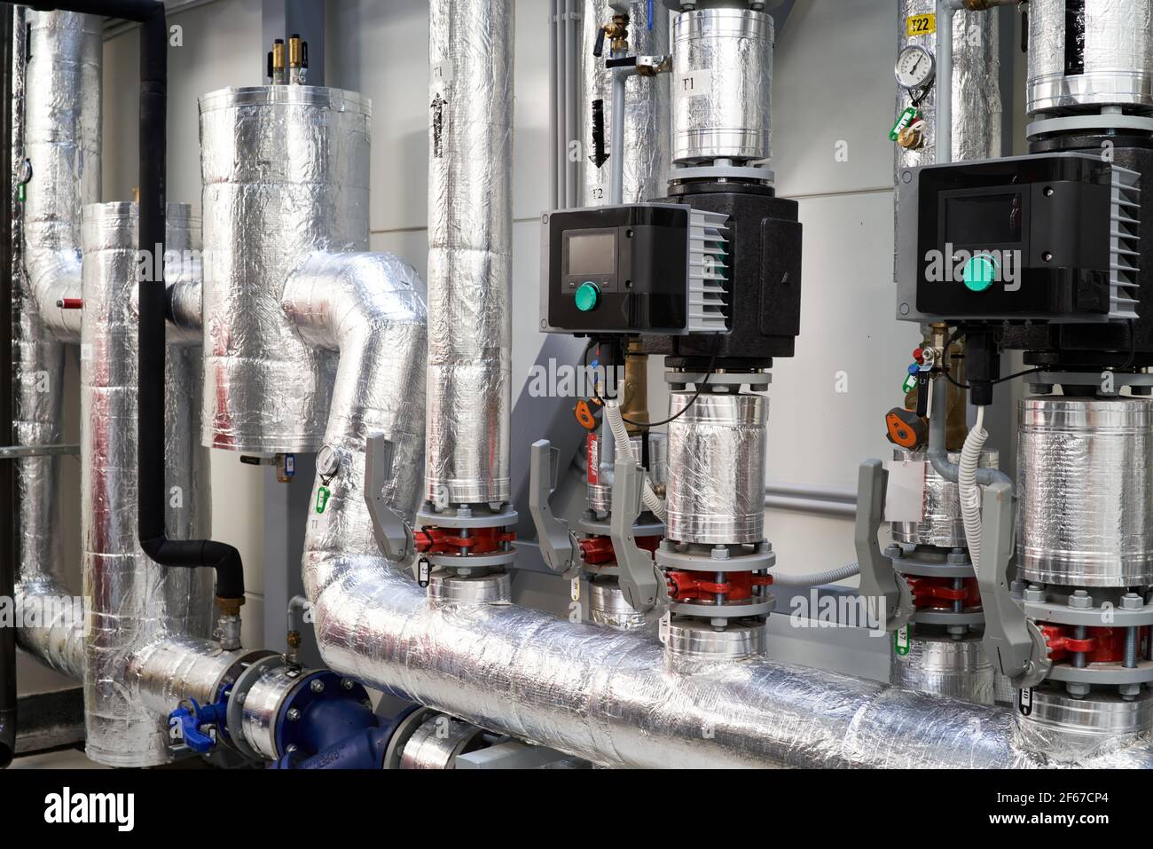 boiler room plant tubes valves circulating water pump Stock Photo