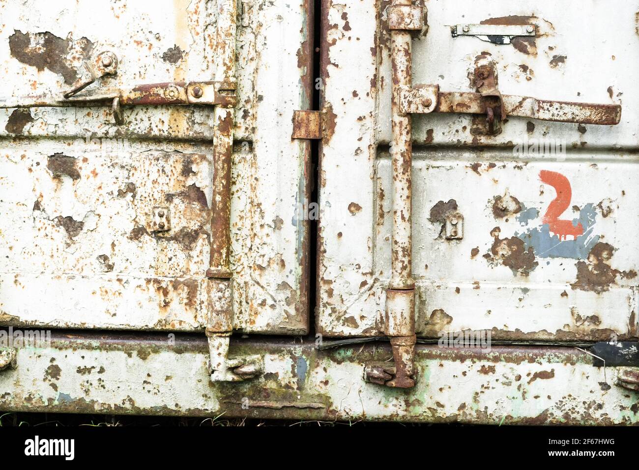 Old rusty shipping container locking system closeup Stock Photo