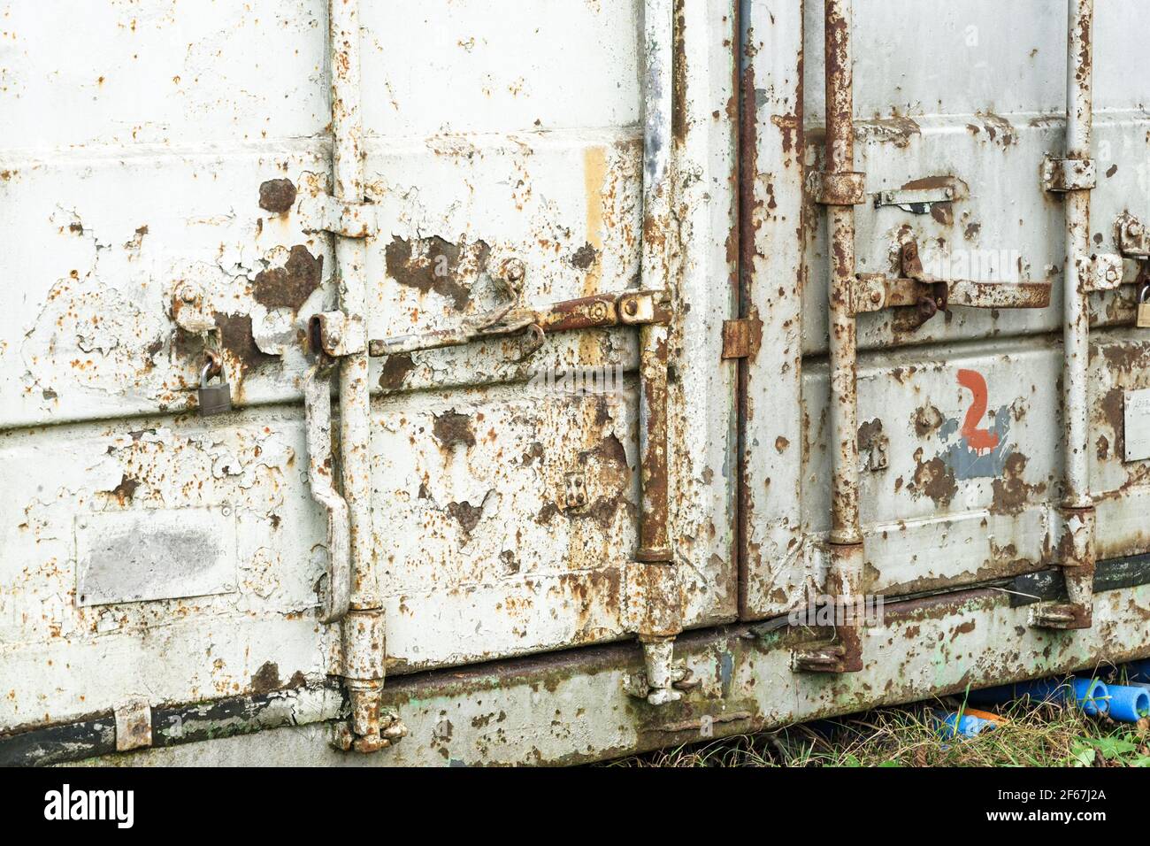 Old damaged rusty shipping container locking system, Stock Photo