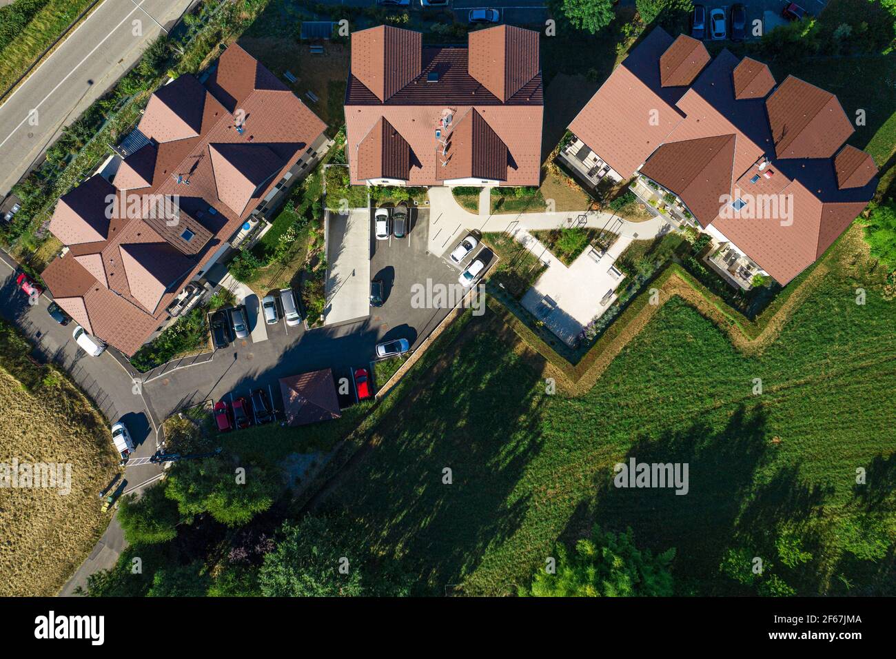 Top down drone view on group of three houses. Aerial view of residential real estate in Annecy, France Stock Photo