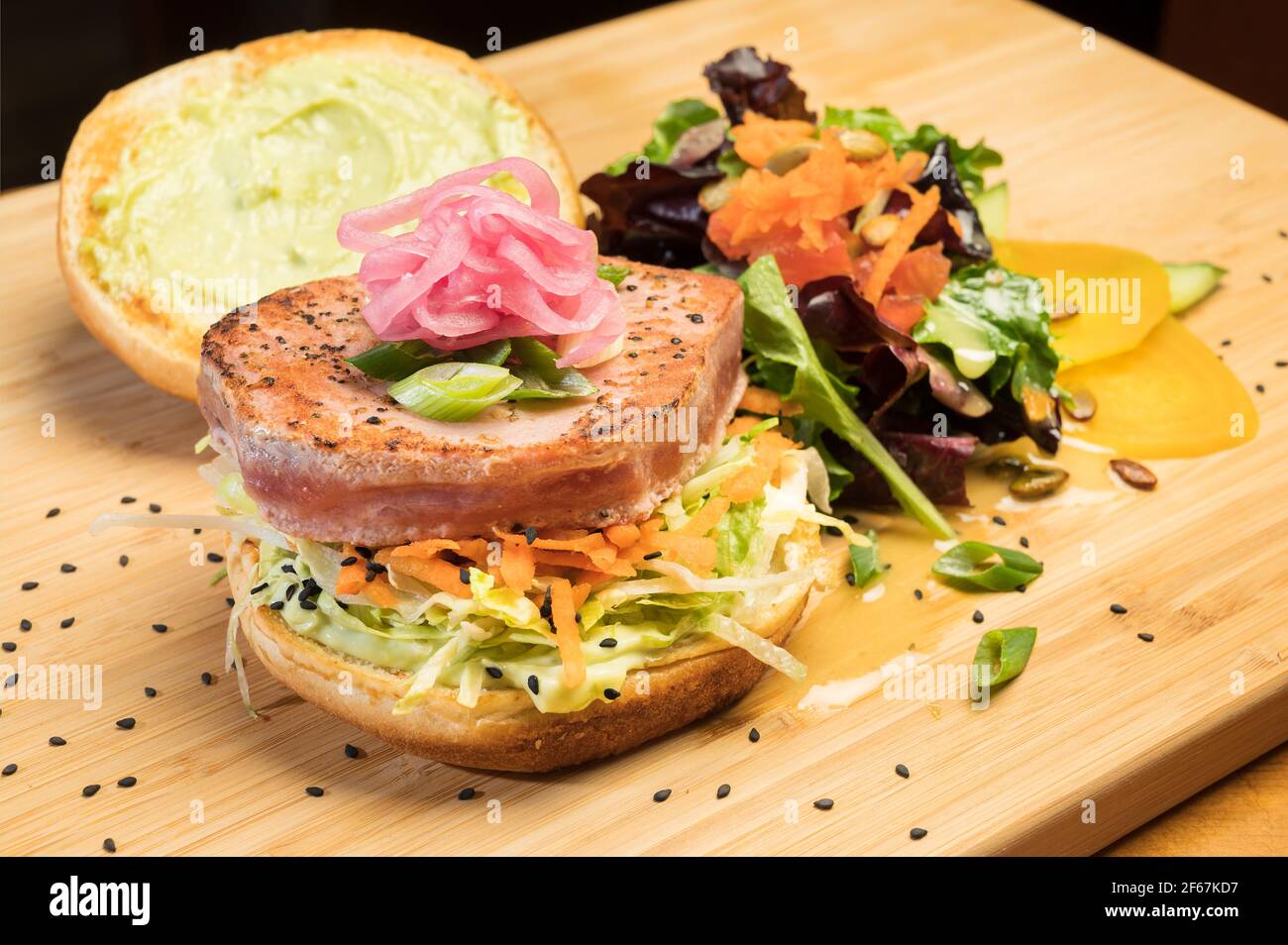 Asian tuna Sandwich at a diner. Grilled yellowfin tuna, Citrus slaw, Asian tzatziki, and pickled