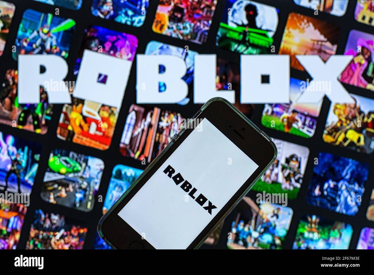 In this photo illustration the Roblox logo is seen on a smartphone screen  in front of Roblox website. (Photo by Pavlo Gonchar / SOPA Images/Sipa USA  Stock Photo - Alamy