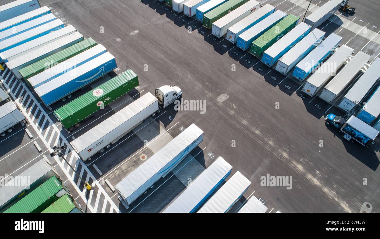 angled view of trucks and their trailers waiting Stock Photo