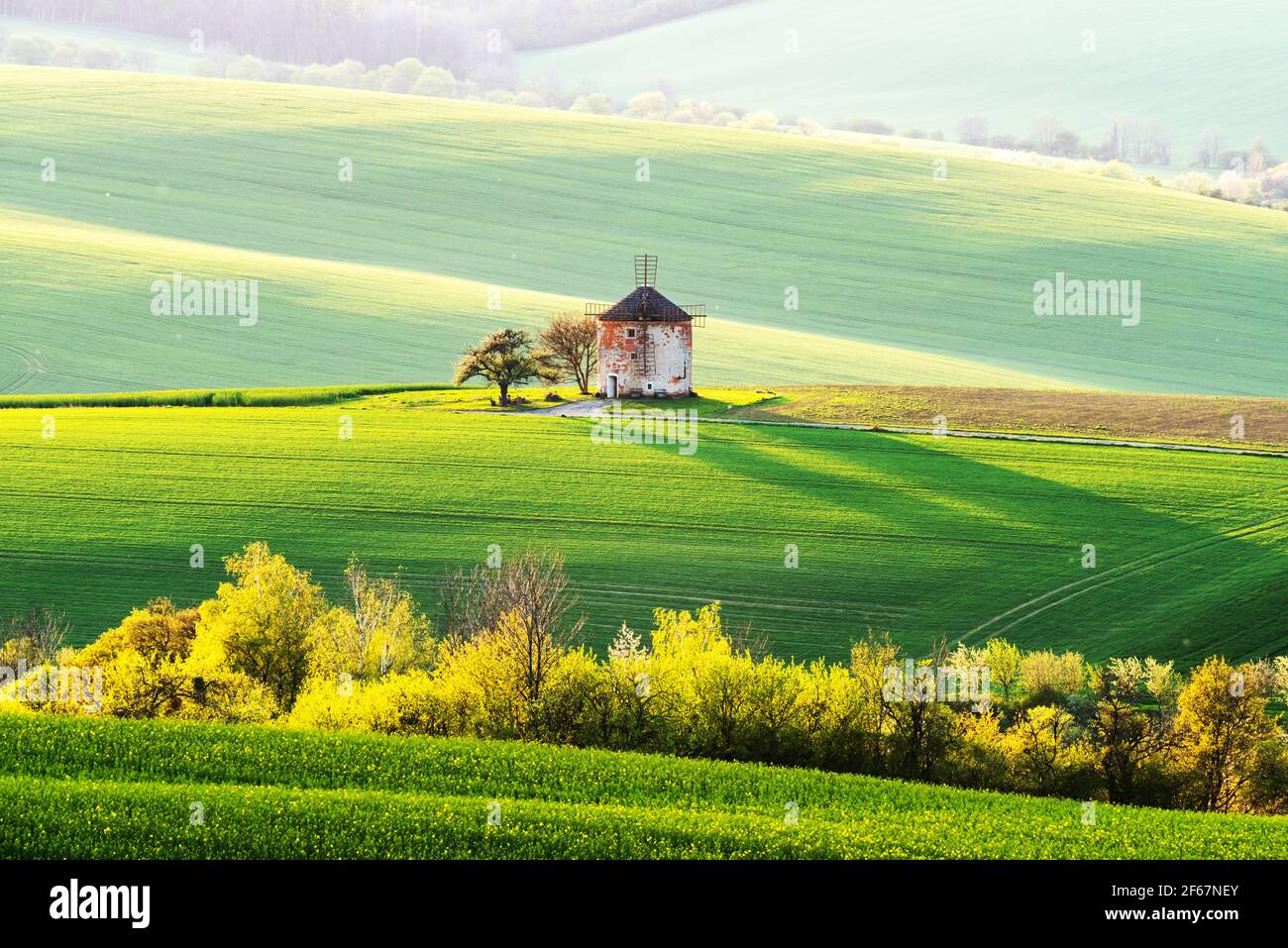 Picturesque rural landscape with old windmill Stock Photo