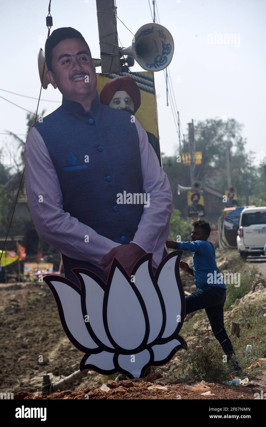 EAST MIDNAPORE, INDIA - MARCH 30: A cut-out of BJP candidate for Nandigram constituency Suvendu Adhikari, being placed during a campaign rally at Nandigram on March 30, 2021 in East Midnapore, India. Nandigram has now become a prestige battle for sitting chief minister Mamata Banerjee and her former lieutenant and now BJP candidate Suvendu Adhikari. Nandigram is the birthplace of the historic land movement that propelled Mamata Banerjee to power by dethroning the Left in 2011. To win what is now being seen as the biggest battle of Bengal, Mamata Banerjee has decided to camp in Nandigram for th Stock Photo
