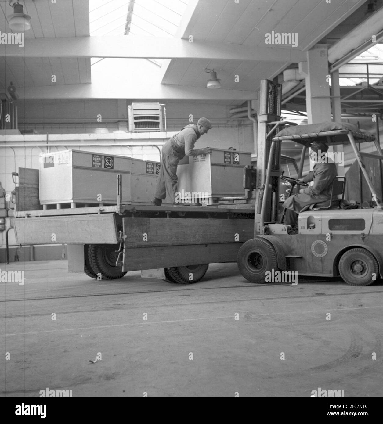 Small containers are loaded with truck, Liljeholmens cable work Stock