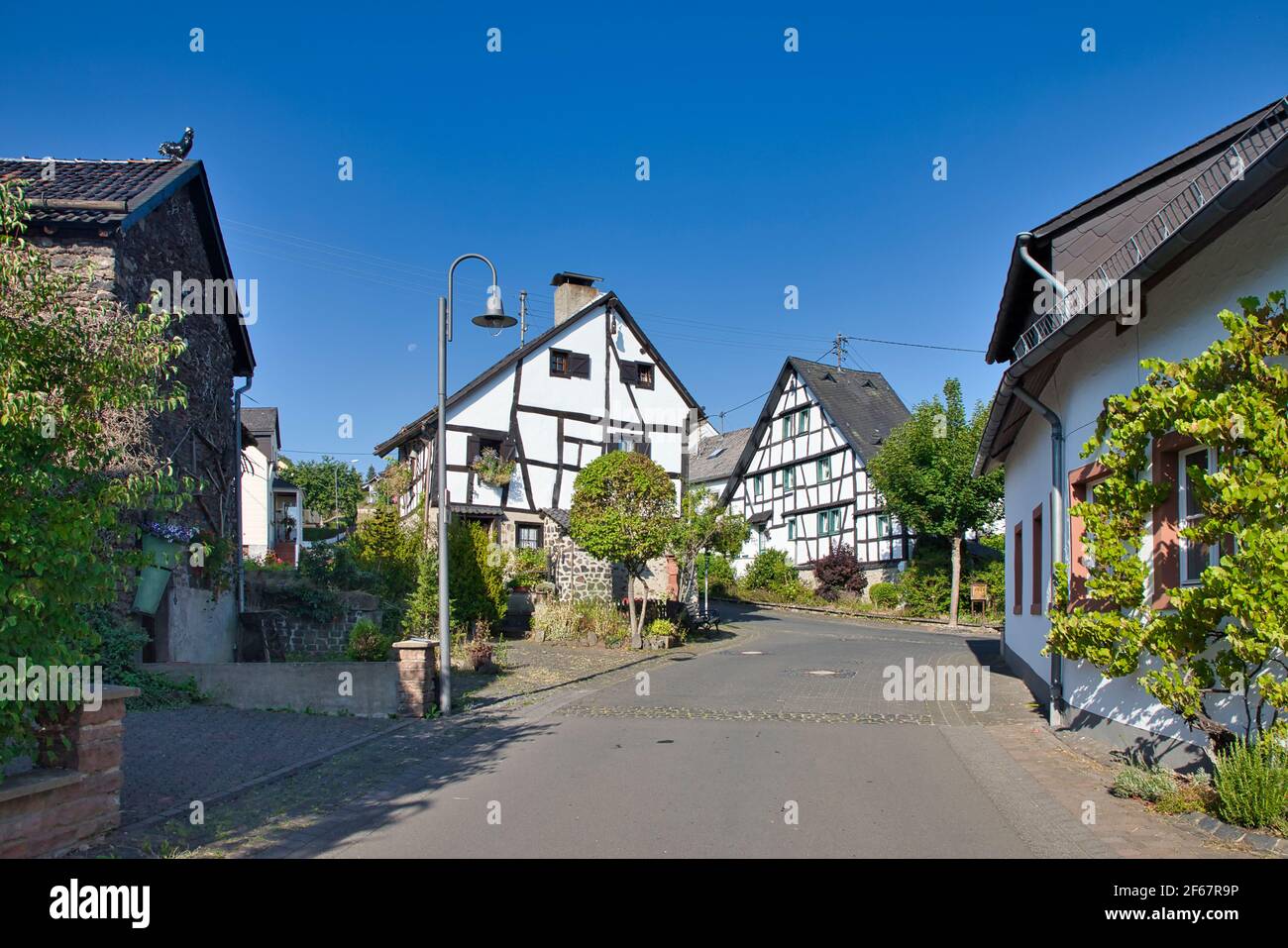 GERMANY, RHINELAND-PALATINATE, SCHALKENMEHREN - AUGUST 08, 2020: Half timbered houses in the village center of Schalkenmehren Stock Photo