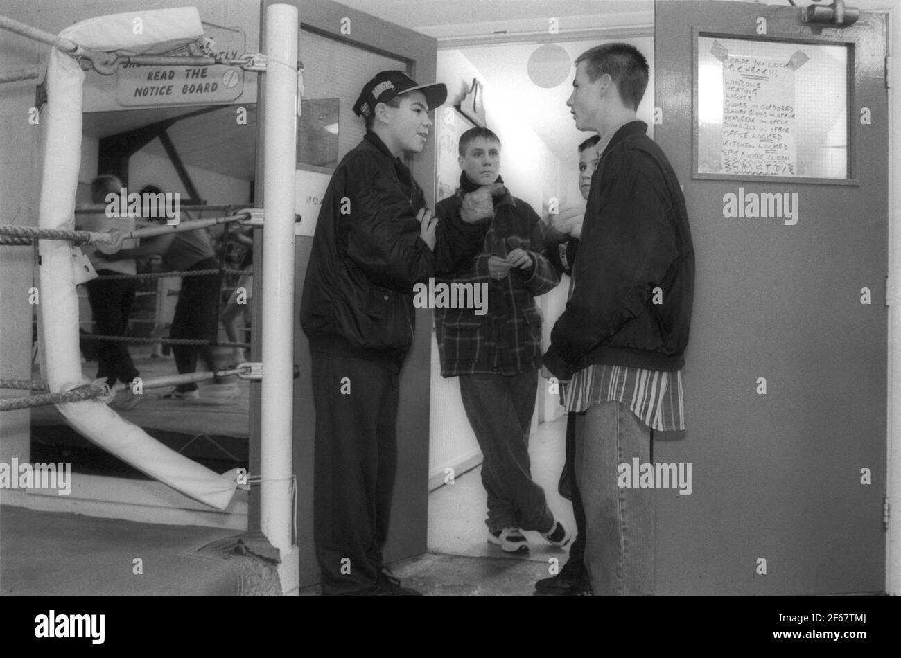 Young teenagers loitering at the door of Boxing club Stock Photo