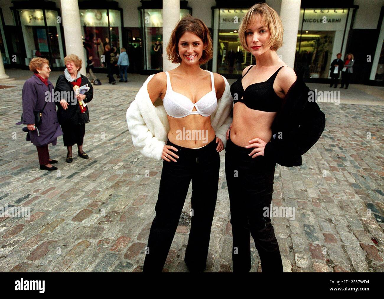 TWO GIRLS MODEL THE NEW BIOFORM BRA FROM CHARNOS CREATED BY DESIGNERS  SEYMOUR POWELL. THE DESIGN OF THE BRA WILL APPARENTLY REVOLUTIONISE THE WAY  BRAS HAVE BEEN PREVIOUSLY MADE Stock Photo 