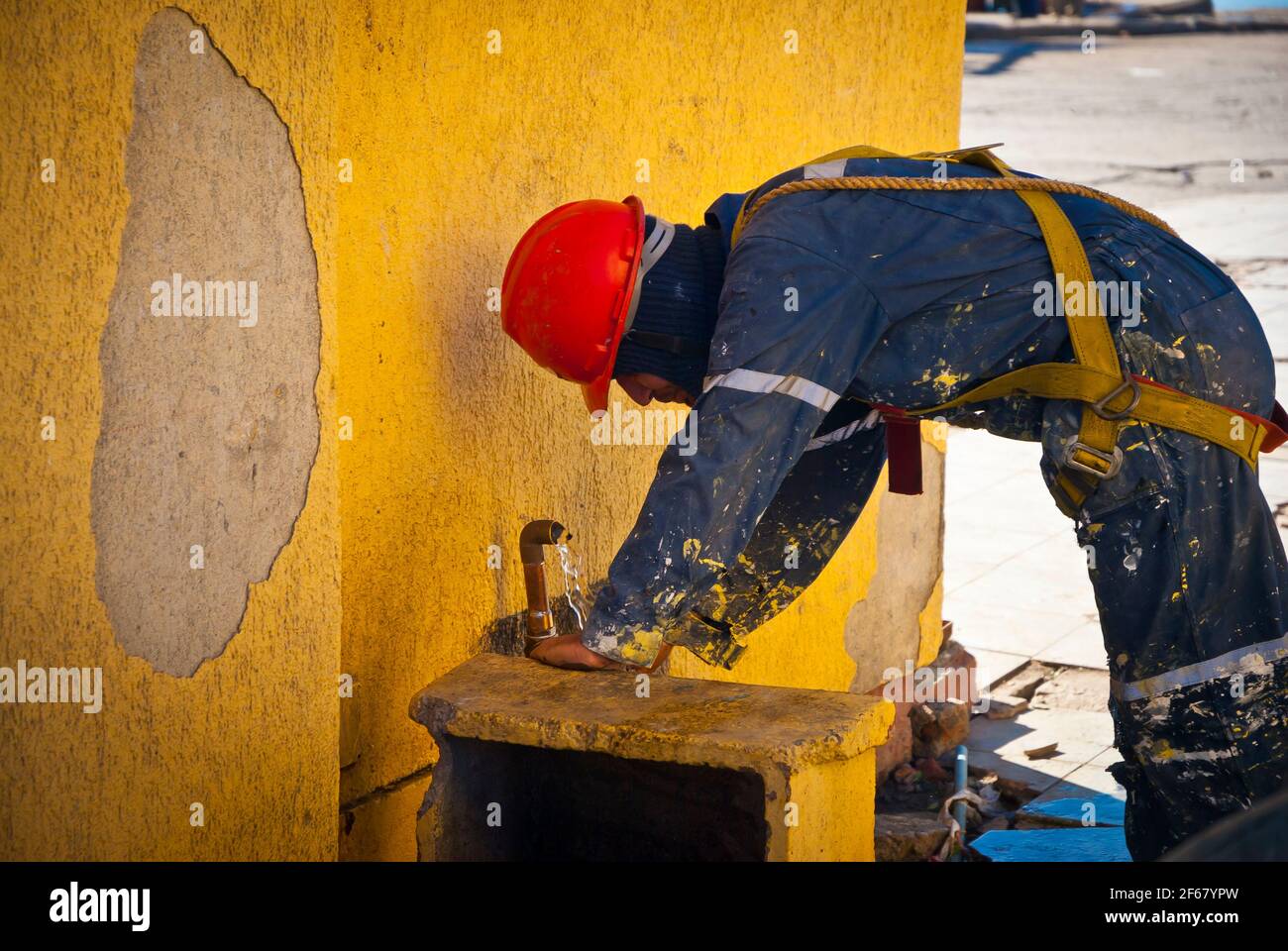 TALCAHUANO, CHILE - APRIL 21, 2010: Worker drinking water Stock Photo