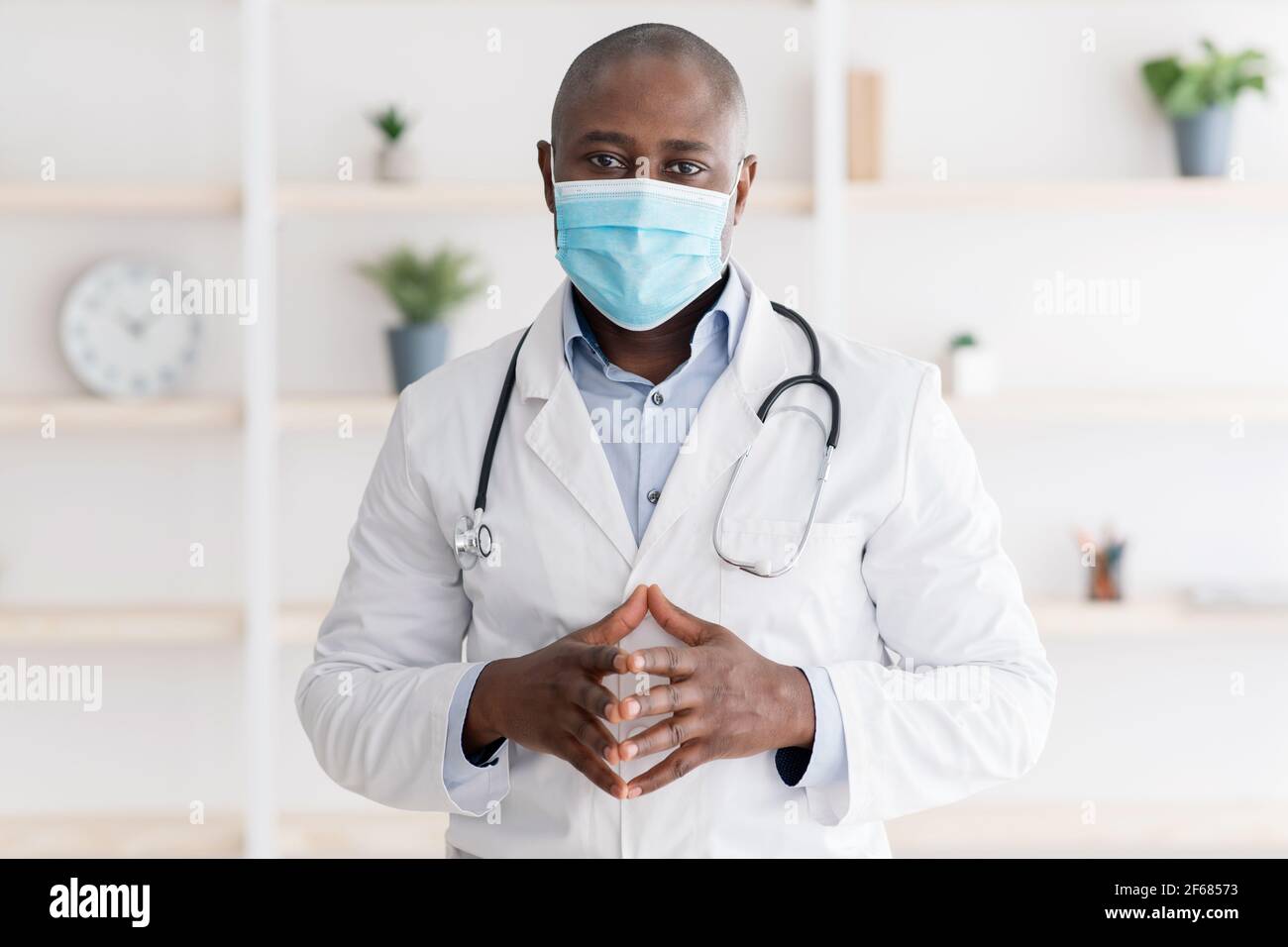 Health and medicine concept. Portrait of confident black doctor in face ...