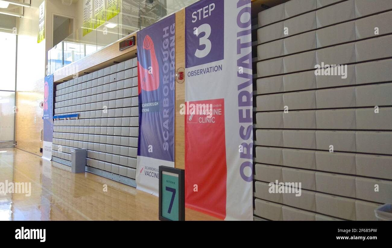 Computer graphic signs on the building interior of the Athletic Centre that use as distribution of mass vaccination clinic. Stock Photo