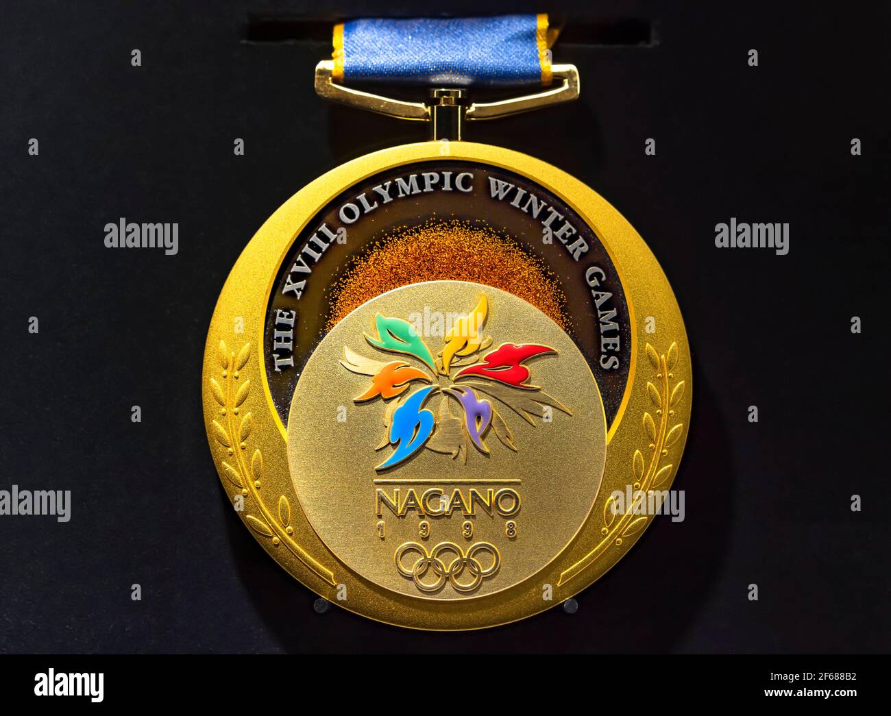 tokyo, japan - march 2 2021: Close up on the official gold medal used during the 1998 Winter Olympics of Nagano exhibited in the Japan Olympic Museum. Stock Photo