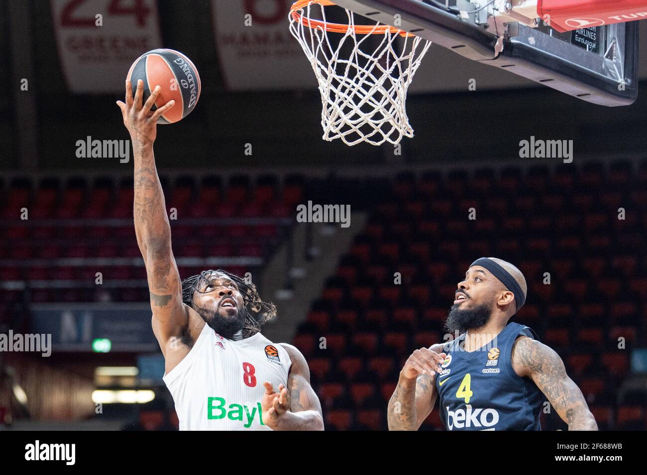 Munich, Germany. 30th Mar, 2021. Basketball: Euroleague, FC Bayern München  - Fenerbahce Istanbul at the Audi Dome. Jalen Reynolds of Bayern Munich (l)  shoots at the basket. On the right Lorenzo Brown