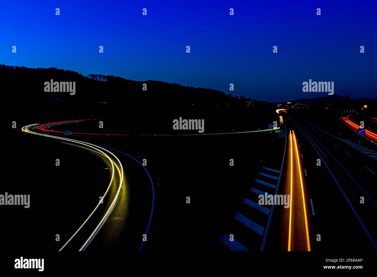 Long exposure shot of an highway with vehicle light trail, shot near Bulle, Fribourg, Switzerland Stock Photo