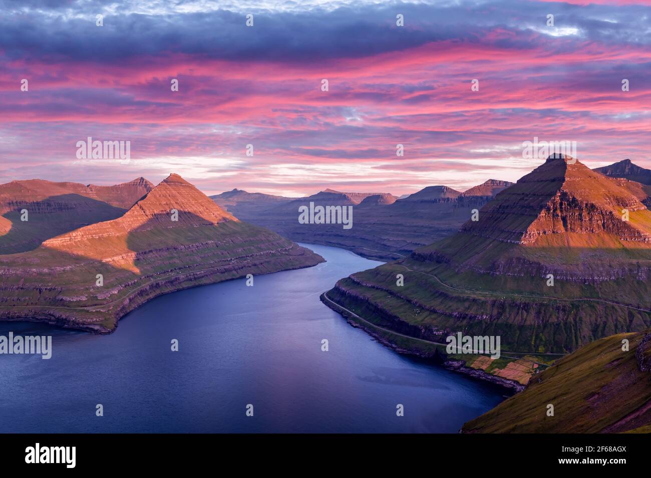 Incredible purple sunset over majestic fjords of Funningur Stock Photo