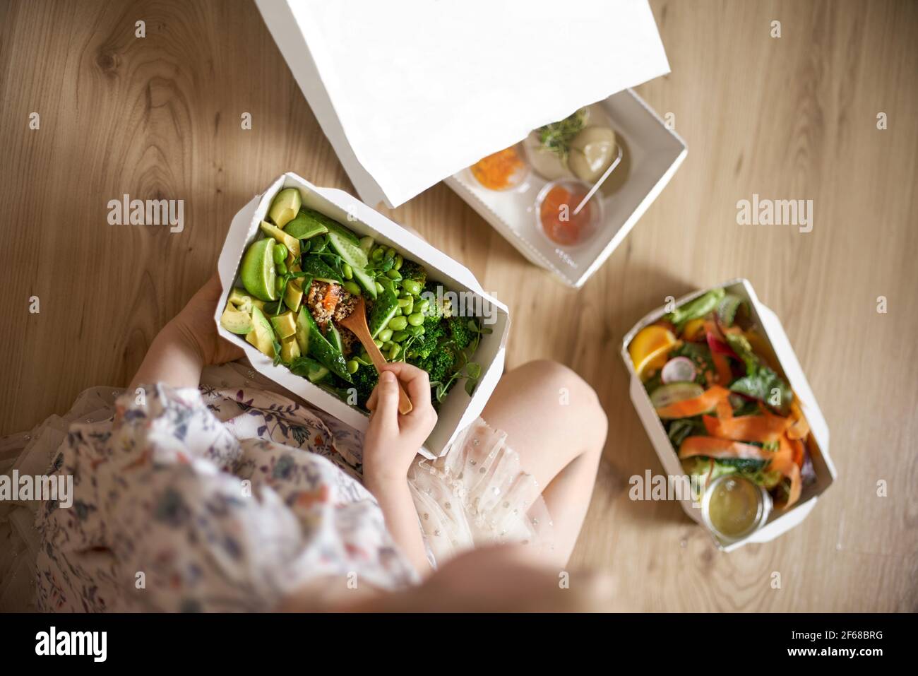 Download Food Delivery Concept The Girl Takes Out Salads From The Package Healthy Food Top View Copy Space Paper Container Mockup Stock Photo Alamy