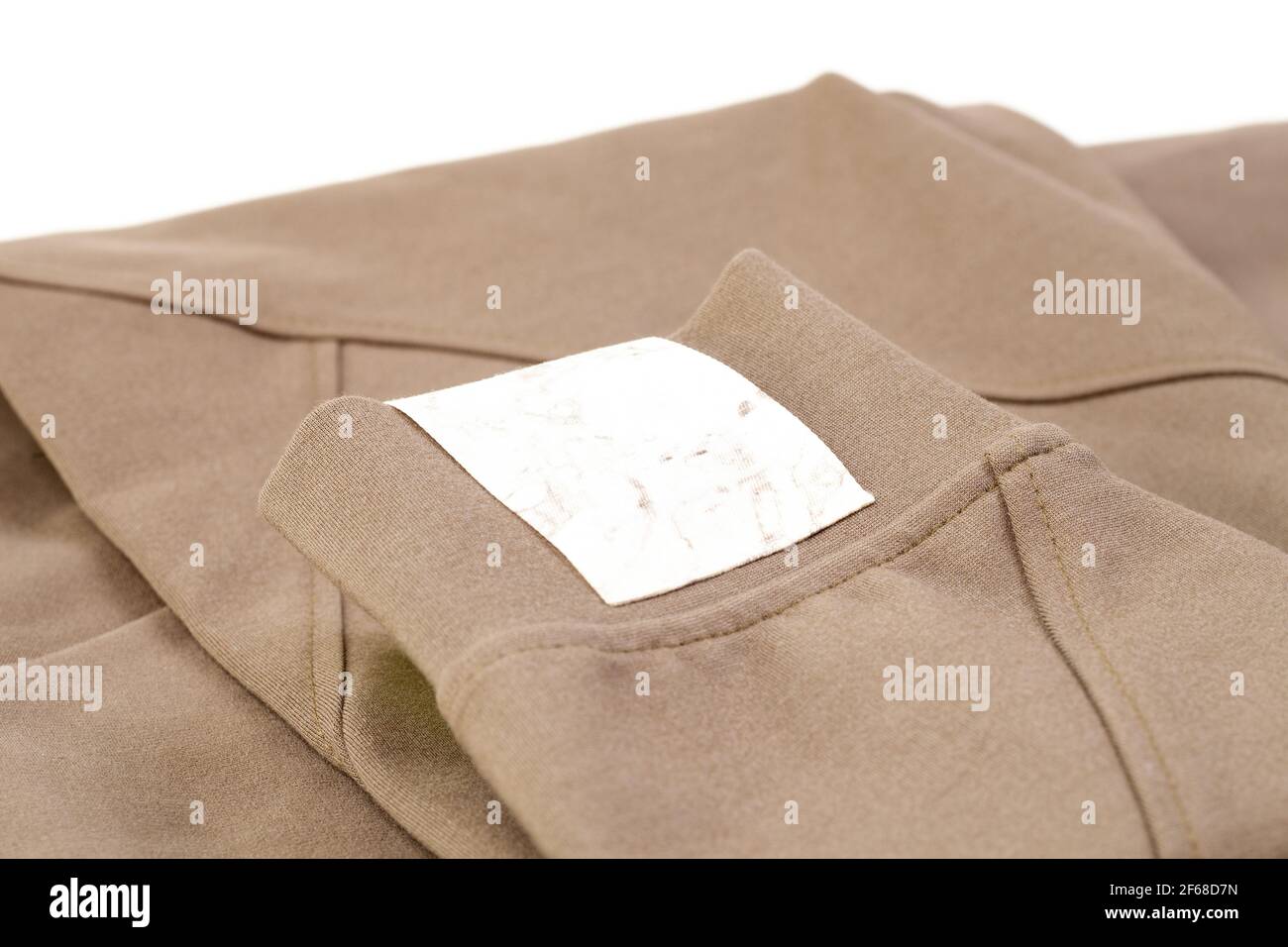 macro mock up empty white marble fabric patch for brand logo, tag for name or clothing care instructions Stock Photo