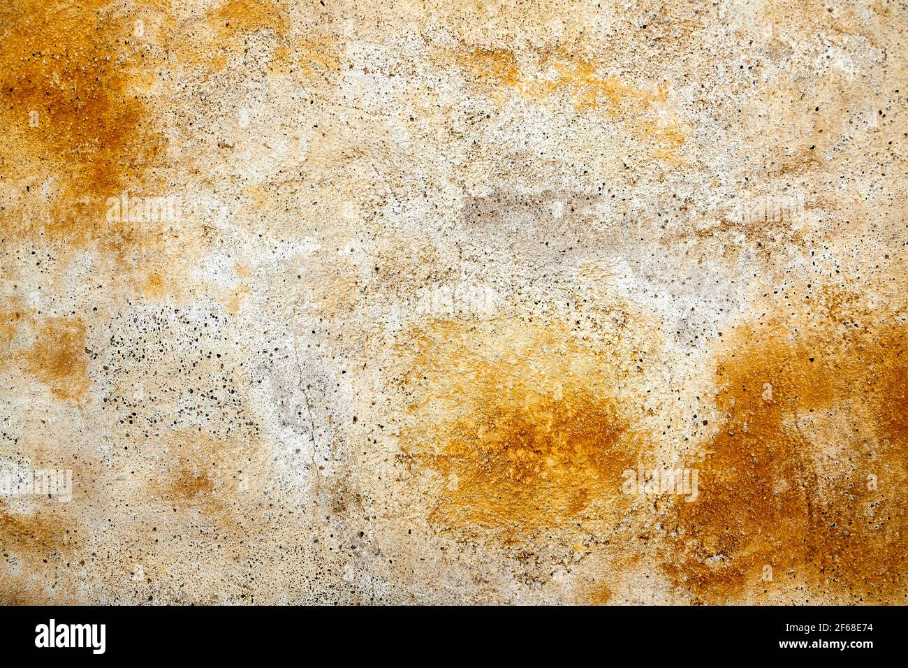 yellow weathered paint on a plastered wall Stock Photo