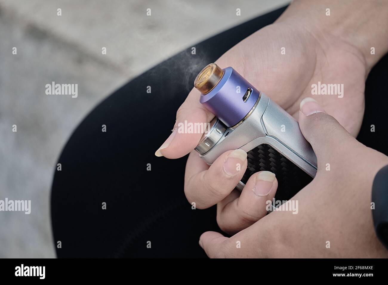 Woman's hands holding electronic cigarette, stop smoking cigarette and
