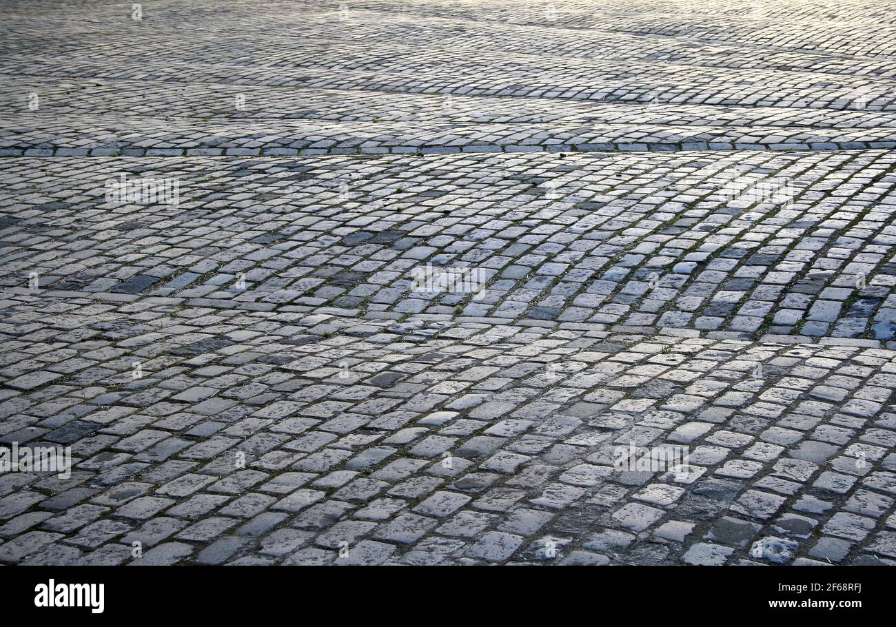 Close-up image of the ground of a square covered by setts Stock Photo