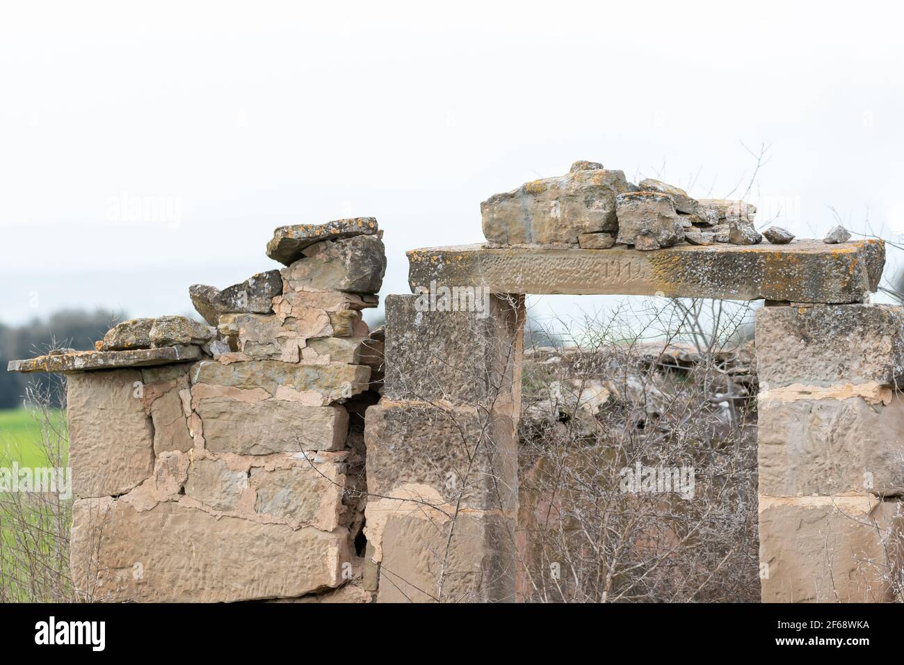 front view of an old farmer's hut made of stone, abandoned and in ruins. Stock Photo