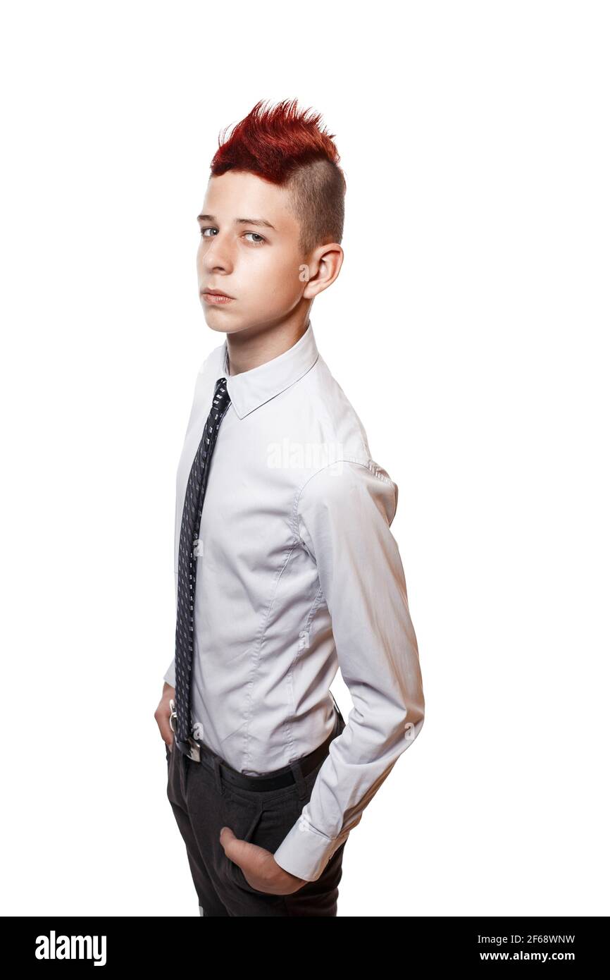 Portrait of serious teen with red mohawk wearing shirt and tie while looking at camera. Isolated. Stock Photo