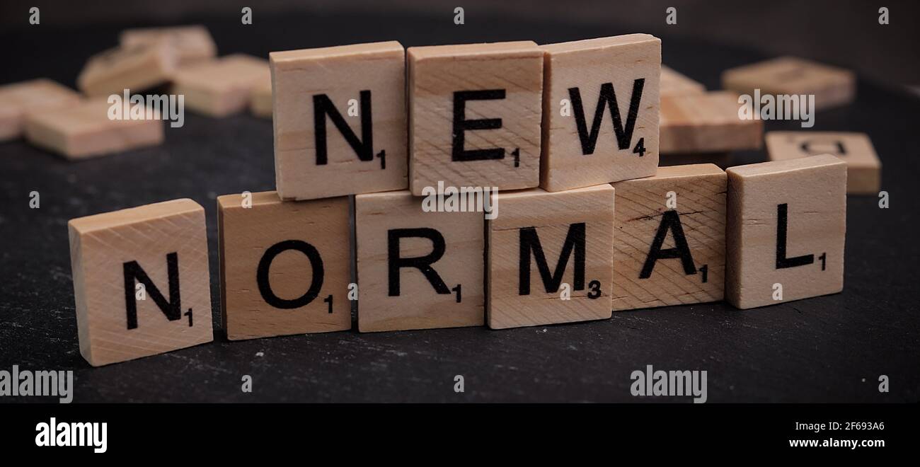The words New Normal written on wooden letter cubes Stock Photo - Alamy