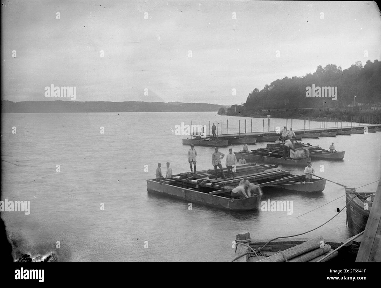 Race at Lake Aspen. Mounting military pontoon bridge. Stock Photo