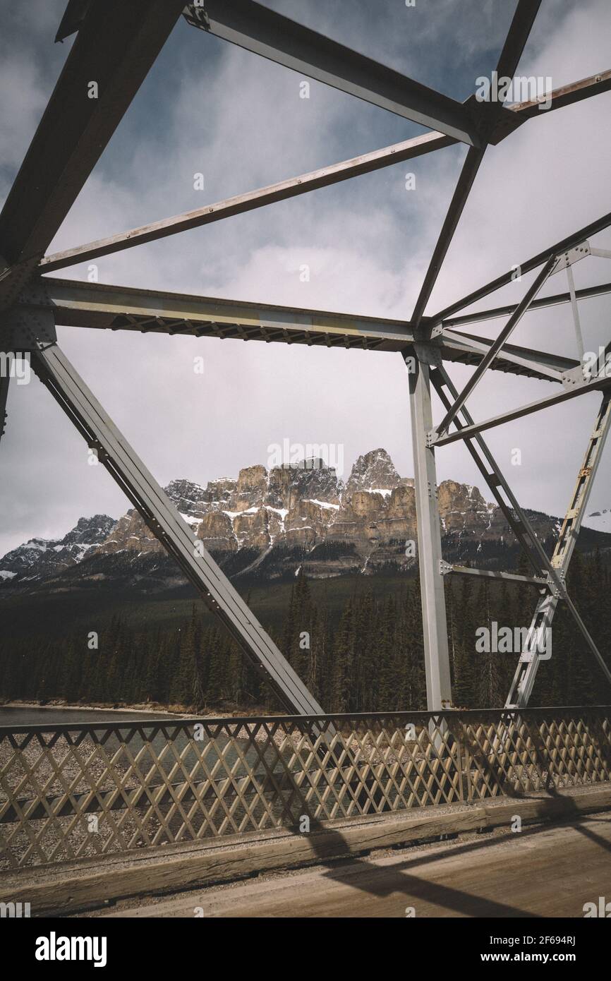 Steel Bridge Snow Dusted Castle Mountian from Across the Bow River. Stock Photo