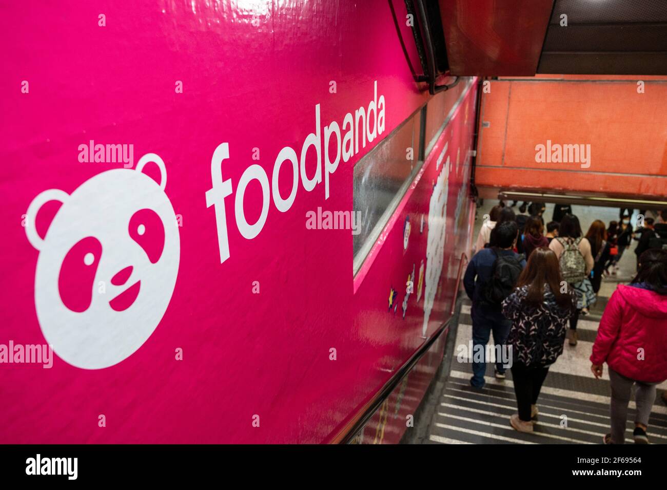 Pedestrians Walk Past A Street Commercial Advertisement Of The Delivery Take Out Food Company Foodpanda Or Food Panda Seen In Hong Kong Photo By Budrul Chukrut Sopa Images Sipa Usa Stock Photo