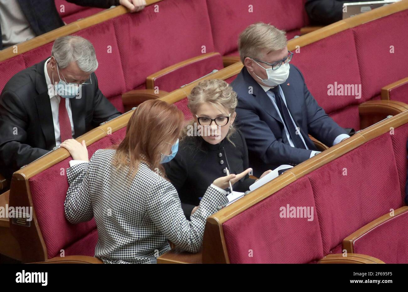 Non Exclusive: KYIV, UKRAINE - MARCH 30, 2021 - Batkivshchyna faction head, MP Yulia Tymoshenko (C) attends an extraordinary sitting of the Ukrainian Stock Photo