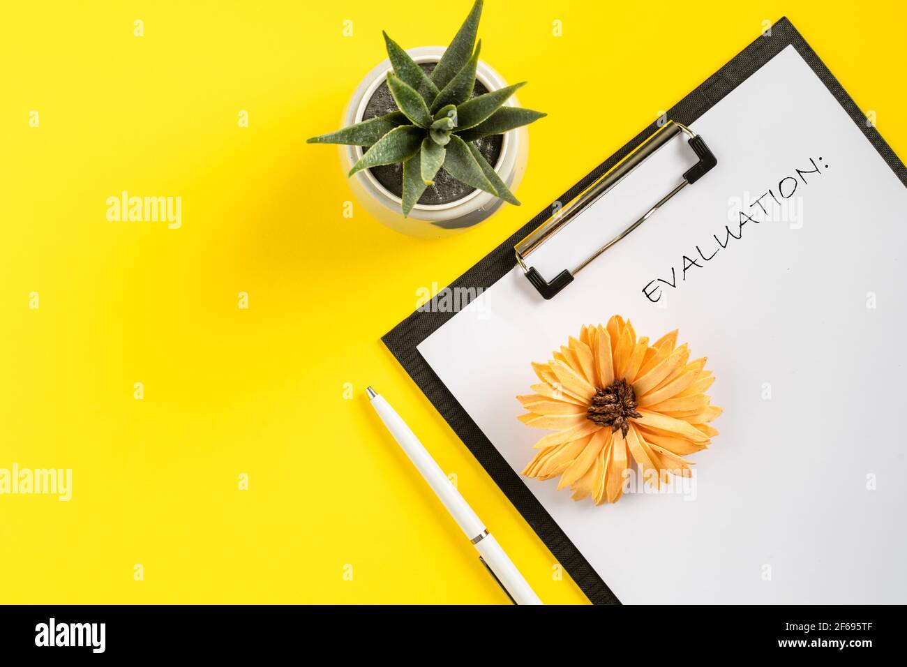 Mock up office accessories on yellow background flat lay of business gadgets evaluation concept Stock Photo