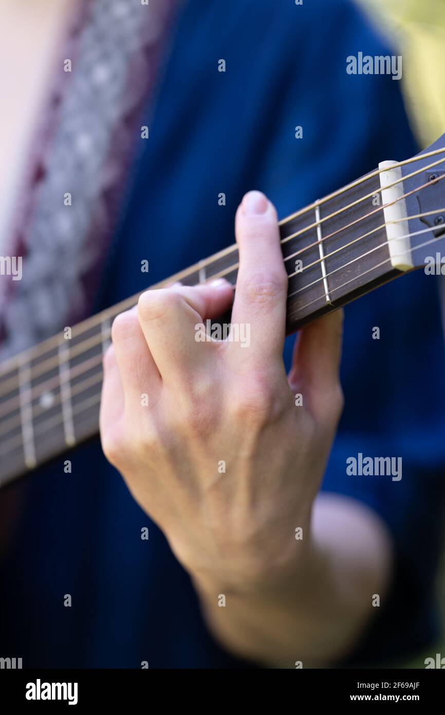 young woman playing guitar in japanese garden Stock Photo Alamy