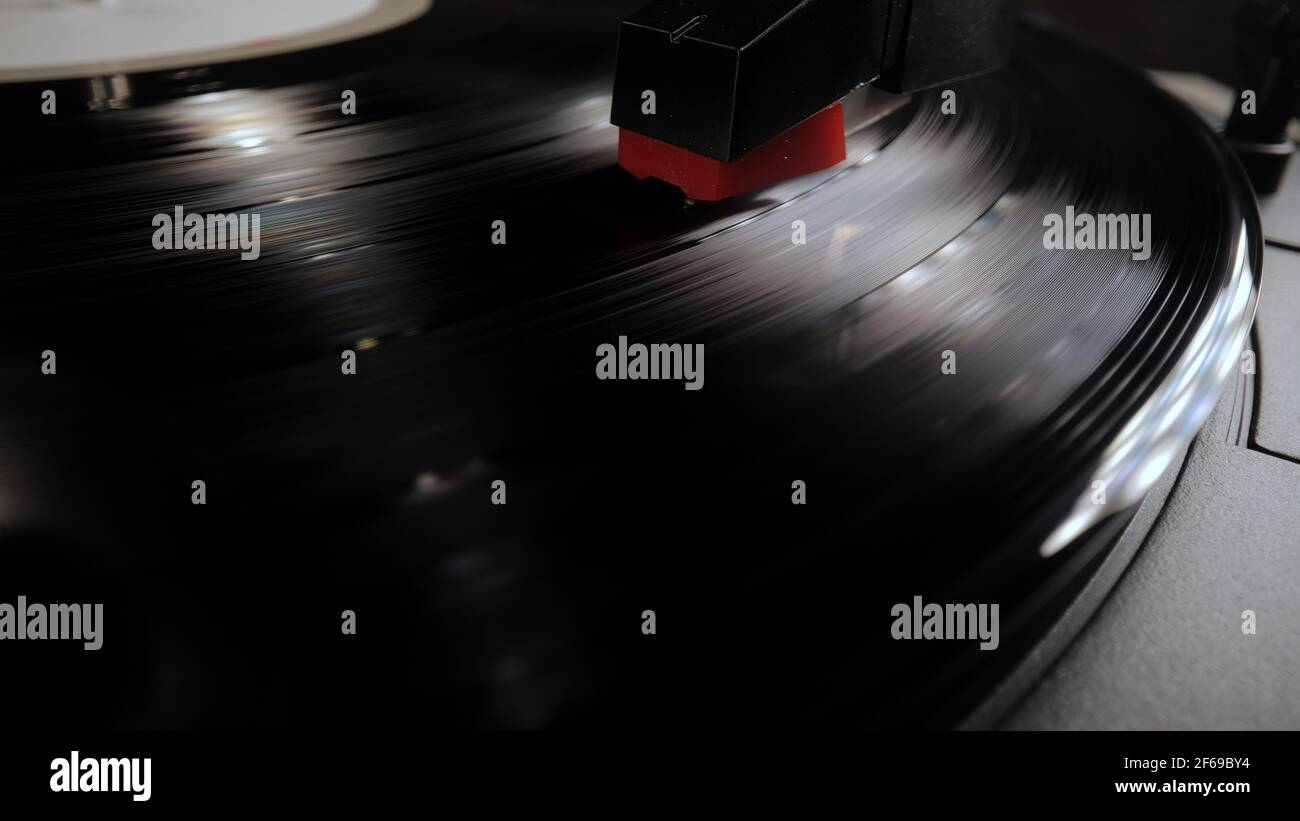Amazing view over a record player playing a vinyl Stock Photo - Alamy