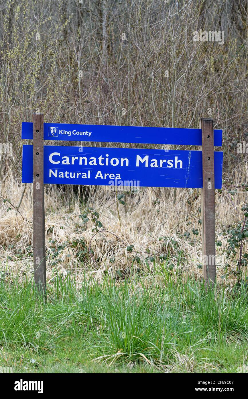 Blue and white King County Washington sign for the Carnation Marsh Natural Area in the Snoqualmie Valley indicating the preserved wetland area Stock Photo